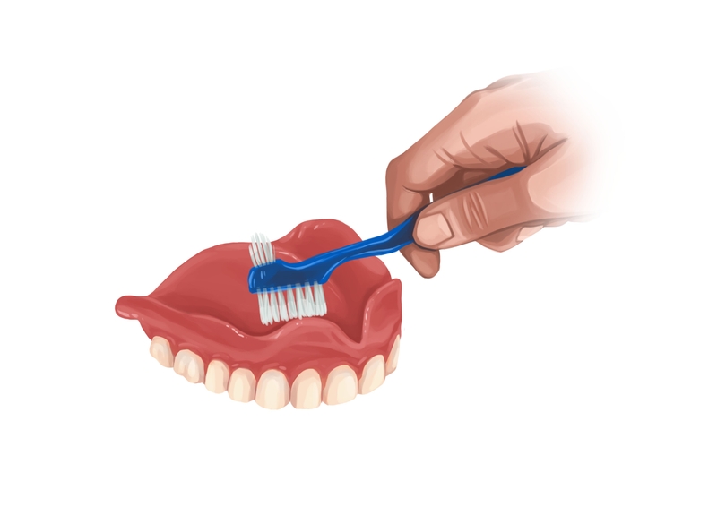 Brushing full upper dentures